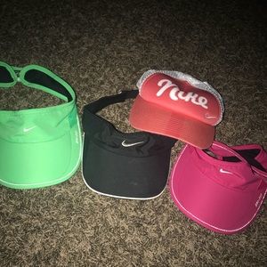 Four Nike hats
